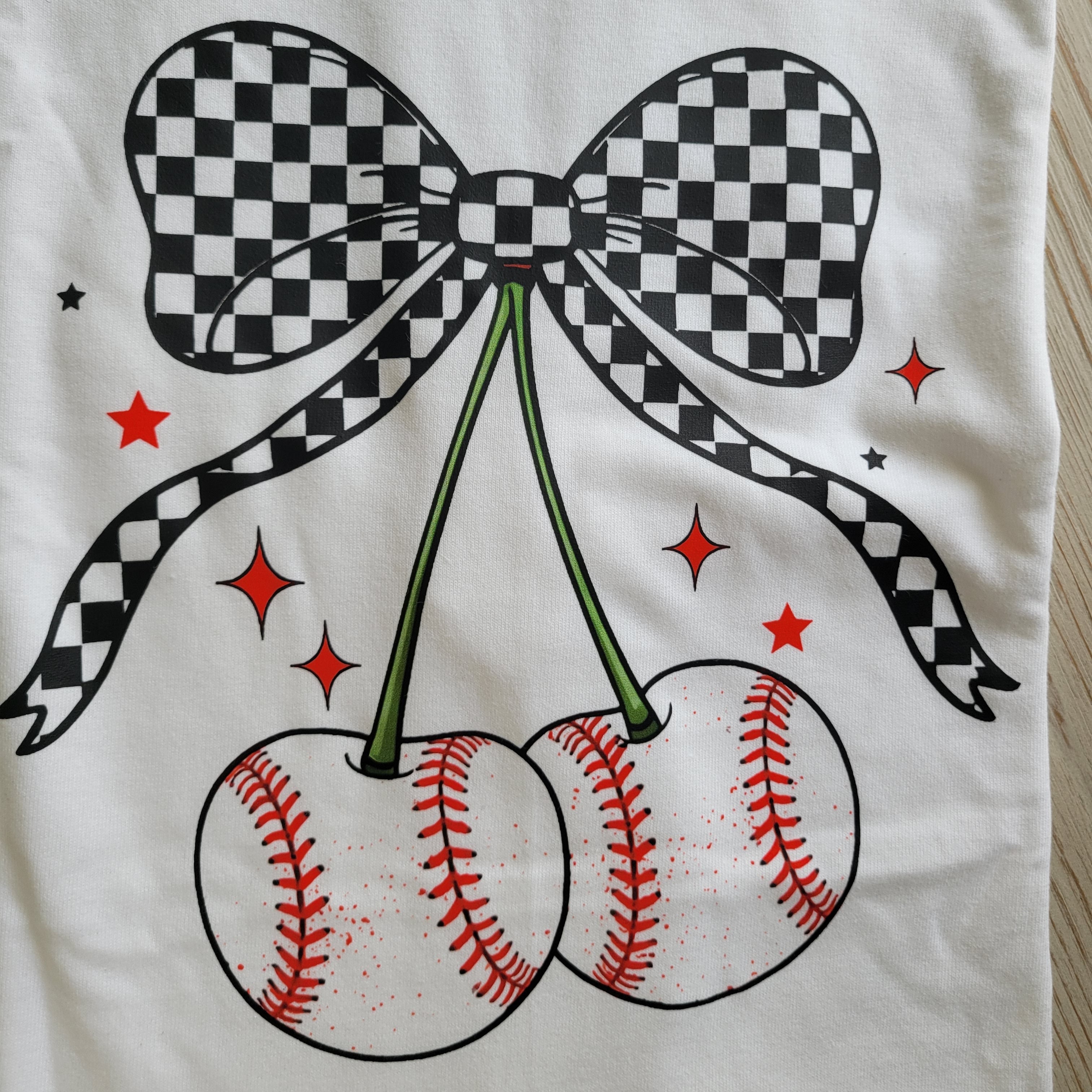 Coquette Checkerboard Baseball Cherry Graphic Tee